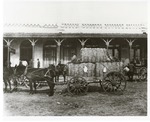 Stores Along Railroad Ave. (Now 100 Block park ave.)-Cotton Wagon in Foreground by Jack Ritchie